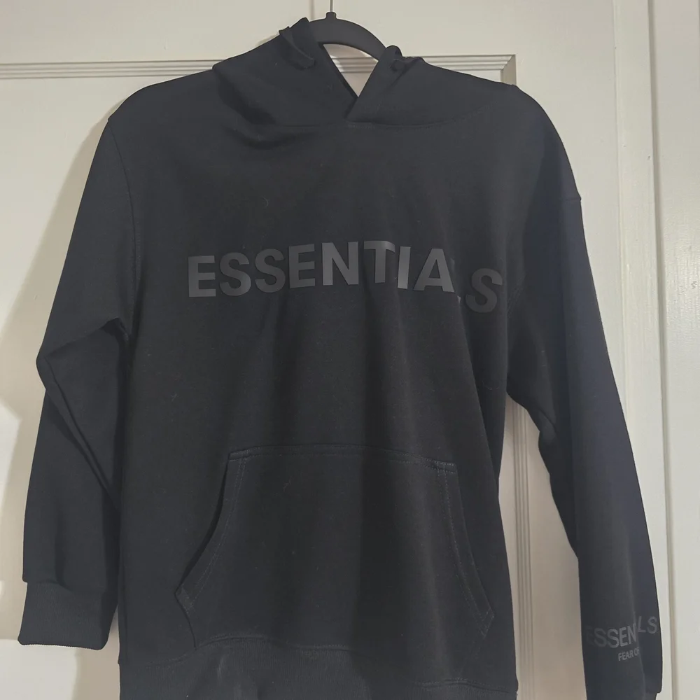 Essentials Black Hoodie - NWOT - Picture 1 of 3